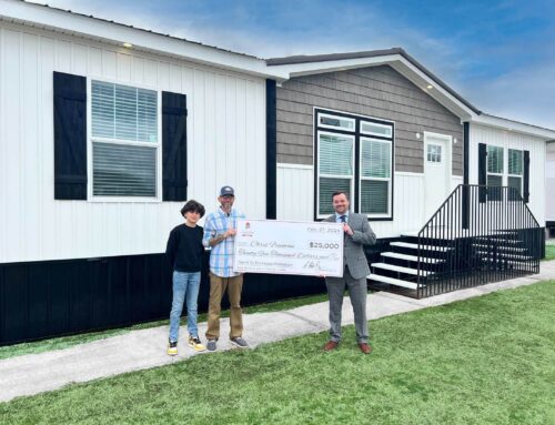 Alabama Manufactured Housing Association Presents Chris Freeman with Check for Winning the “Take It To The House” Contest with the Alabama Crimson Tide and the Auburn Tigers